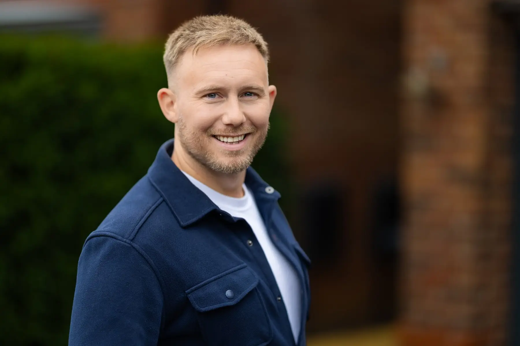 Jamie Burke outside a client's home in Worsley